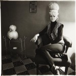 Фотография | Diane Arbus | Lady bartender at home with a souvenir dog